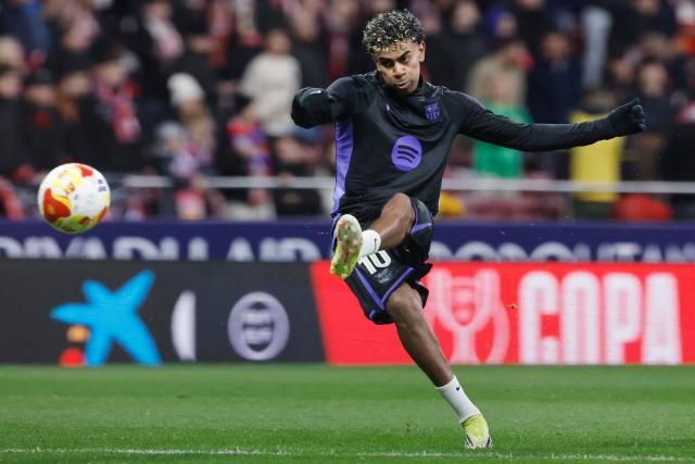 Barcelona's Spanish forward #10 Lamine Yamal warms up before the Spanish Copa del Rey (King's Cup) semi final first leg football match between Club Atletico de Madrid and FC Barcelona at Metropolitano Stadium in Madrid on February 12, 2026. (Photo by Oscar DEL POZO / AFP)