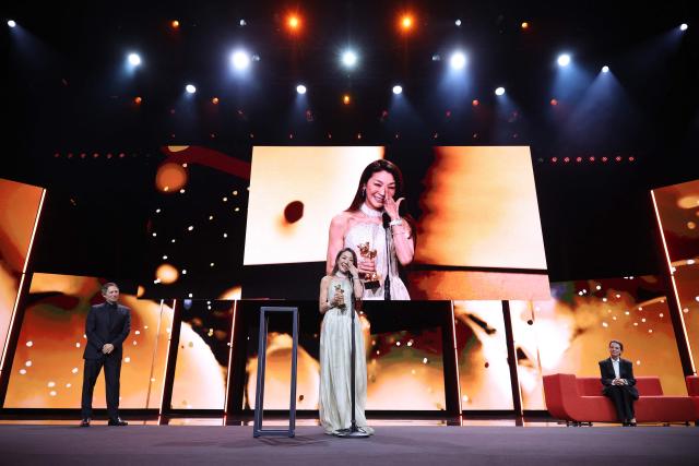 Malaysian actress Michelle Yeoh speaks after being awarded the Honorary Golden Bear during the opening ceremony of the 76th Berlinale, Europe's first major film festival of the year, in Berlin on February 12, 2026. Yeoh is awarded the prize "in recognition of her outstanding achievements in film and cinema". (Photo by Ronny HARTMANN / AFP)