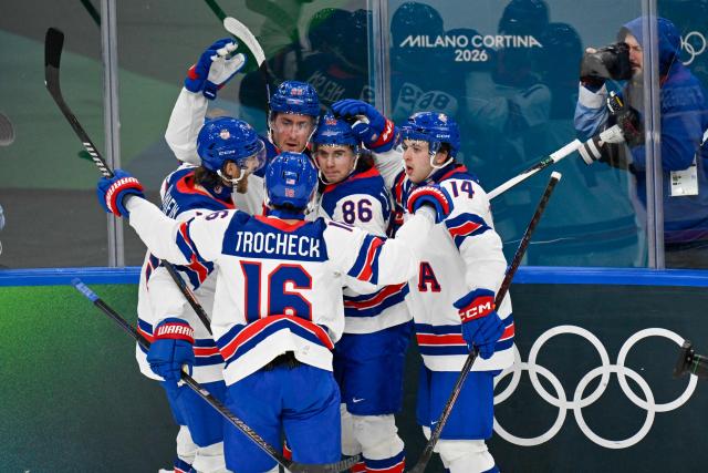 USA's #29 Brock Nelson (C) celebrates after scoring their second goal during the men's preliminary round Group C Ice Hockey match between Latvia and USA at the Milano Santagiulia Ice Hockey Arena during the Milano Cortina 2026 Winter Olympic Games in Milan, on February 12, 2026. (Photo by Alexander NEMENOV / AFP)