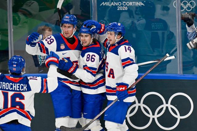 USA's #29 Brock Nelson (L) celebrates after scoring their second goal during the men's preliminary round Group C Ice Hockey match between Latvia and USA at the Milano Santagiulia Ice Hockey Arena during the Milano Cortina 2026 Winter Olympic Games in Milan, on February 12, 2026. (Photo by Alexander NEMENOV / AFP)
