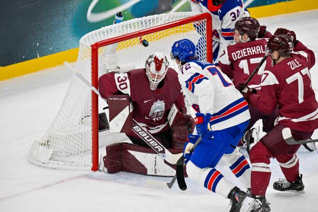 USA's #72 Tage Thompson scores their third goal during the men's preliminary round Group C Ice Hockey match between Latvia and USA at the Milano Santagiulia Ice Hockey Arena during the Milano Cortina 2026 Winter Olympic Games in Milan, on February 12, 2026. (Photo by Alexander NEMENOV / AFP)