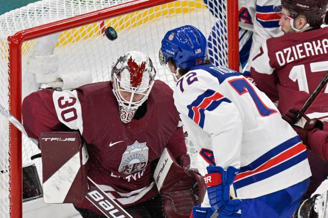 USA's #72 Tage Thompson scores their third goal during the men's preliminary round Group C Ice Hockey match between Latvia and USA at the Milano Santagiulia Ice Hockey Arena during the Milano Cortina 2026 Winter Olympic Games in Milan, on February 12, 2026. (Photo by Alexander NEMENOV / AFP)