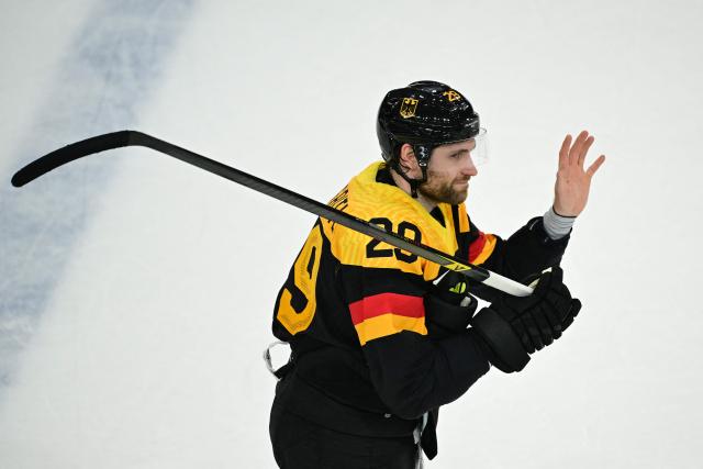 Germany's #29 Leon Draisaitl reacts after winning the  men's preliminary round Group C Ice Hockey match between Germany and Denmark at the Milano Rho Ice Hockey Arena at the Milano Cortina 2026 Winter Olympic Games in Milan, on February 12, 2026. (Photo by Piero CRUCIATTI / AFP)
