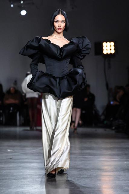 A model walks the runway during the Christian Siriano Fall/Winter 2026 fashion show in New York, on February 12, 2026. (Photo by CHARLY TRIBALLEAU / AFP)