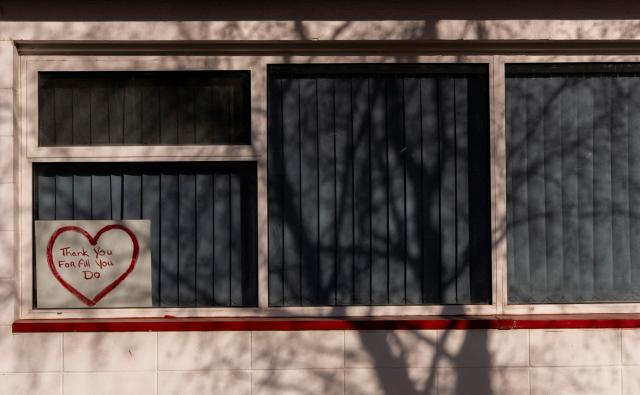 A sign of appreciation sits in the window of the Fire & Rescue Facility days after the rural community experienced one of Canadas deadliest shootings in Tumbler Ridge, British Columbia on February 12, 2026. On February 10, an 18-year-old carried out a mass shooting in a remote mining town, killing six people at a local school, after slaying her mother and stepbrother. Canadian Police commander Dwayne McDonald said authorities still don't know the motive in Tuesday's mass shooting, but the shooter, who took her own life, was known to have mental health issues. (Photo by Paige Taylor White / AFP)