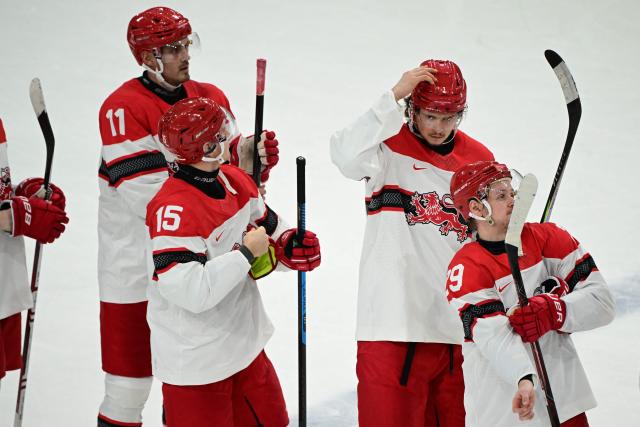Denmark's players react after losing the men's preliminary round Group C Ice Hockey match between Germany and Denmark at the Milano Rho Ice Hockey Arena at the Milano Cortina 2026 Winter Olympic Games in Milan, on February 12, 2026. (Photo by Piero CRUCIATTI / AFP)