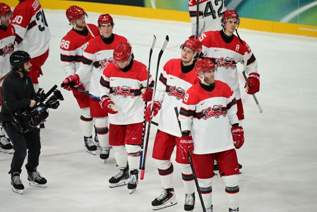 Denmark's players react after losing the men's preliminary round Group C Ice Hockey match between Germany and Denmark at the Milano Rho Ice Hockey Arena at the Milano Cortina 2026 Winter Olympic Games in Milan, on February 12, 2026. (Photo by Piero CRUCIATTI / AFP)