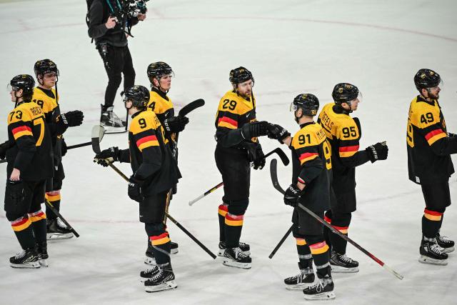 Germany's player celebrate fter winning the men's preliminary round Group C Ice Hockey match between Germany and Denmark at the Milano Rho Ice Hockey Arena at the Milano Cortina 2026 Winter Olympic Games in Milan, on February 12, 2026. (Photo by Piero CRUCIATTI / AFP)