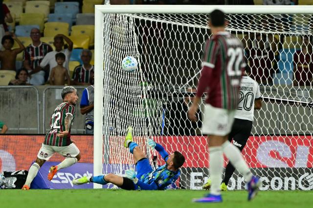 Fluminense's Argentine midfielder #32 Luciano Acosta scores the opening goal during the Campeonato Brasileiro Serie A football match between Fluminense and Botafogo at the Maracana Stadium in Rio de Janeiro, Brazil, on February 12, 2026. (Photo by Pablo PORCIUNCULA / AFP)