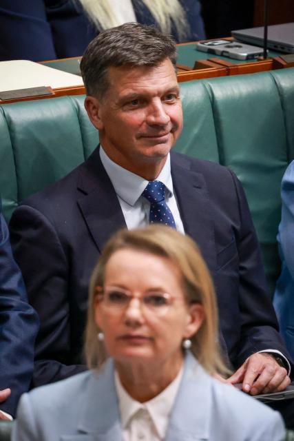 Australias opposition Liberal Party member Angus Taylor (top) sits behind leader Sussan Ley, the party's first female leader, during Question Time at Federal Parliament in Canberra on February 11, 2026. Australia's centre-right opposition Liberal Party on February 13 elected as leader a conservative who lobbied to drop its commitment to net zero emissions, local media reported. Angus Taylor -- a former energy minister -- replaces Sussan Ley, the party's first female leader who had been in office for less than a year. (Photo by DAVID GRAY / AFP)