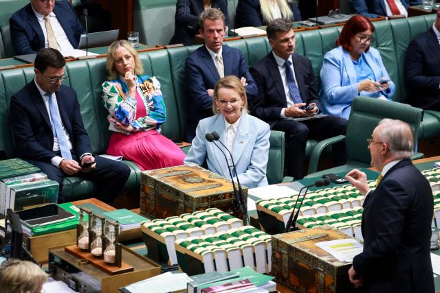 Australia’s opposition Liberal Party leader Sussan Ley (C), the party's first female leader, listens to Australia’s Prime Minister Anthony Albanese (R) as he speaks during Question Time at Federal Parliament in Canberra on February 11, 2026. Australia's centre-right opposition Liberal Party on February 13 elected as leader a conservative who lobbied to drop its commitment to net zero emissions, local media reported. Angus Taylor -- a former energy minister -- replaces Sussan Ley, the party's first female leader who had been in office for less than a year. (Photo by DAVID GRAY / AFP)