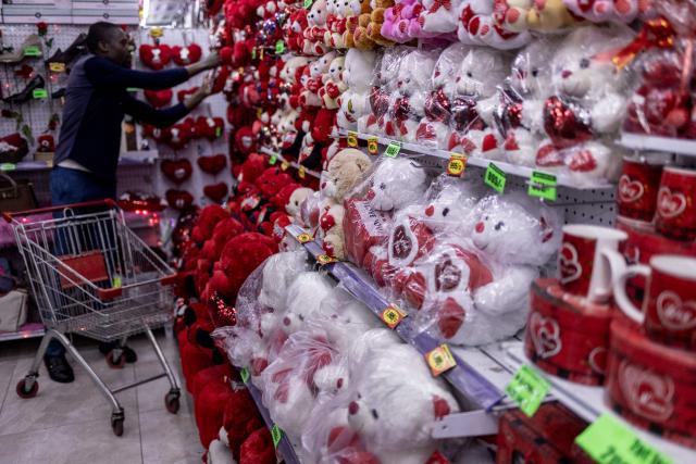 A customer shops for gifts and flowers at the House of Leather ahead of Valentine's Day in Nairobi, on February 11, 2026. (Photo by SIMON MAINA / AFP)