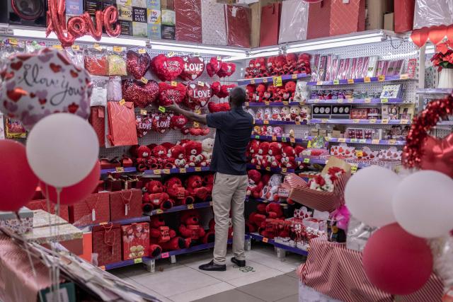 A customer shops for gifts and flowers at the House of Leather ahead of Valentine's Day in Nairobi, on February 11, 2026. (Photo by SIMON MAINA / AFP)