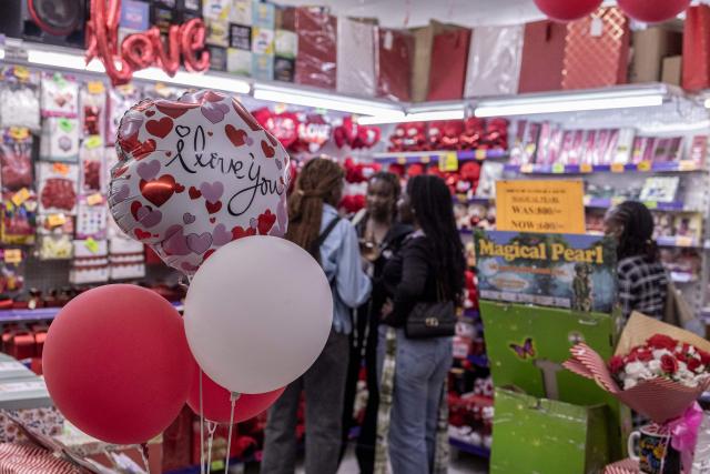 Customers shop for gifts and flowers at the House of Leather ahead of Valentine's Day in Nairobi, on February 11, 2026. (Photo by SIMON MAINA / AFP)