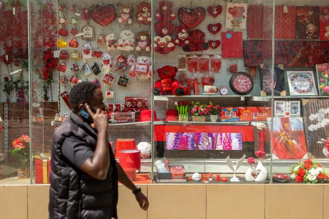 A pedestrian walks past House of Leather gift shop ahead of Valentine's Day in Nairobi, on February 11, 2026. (Photo by SIMON MAINA / AFP)
