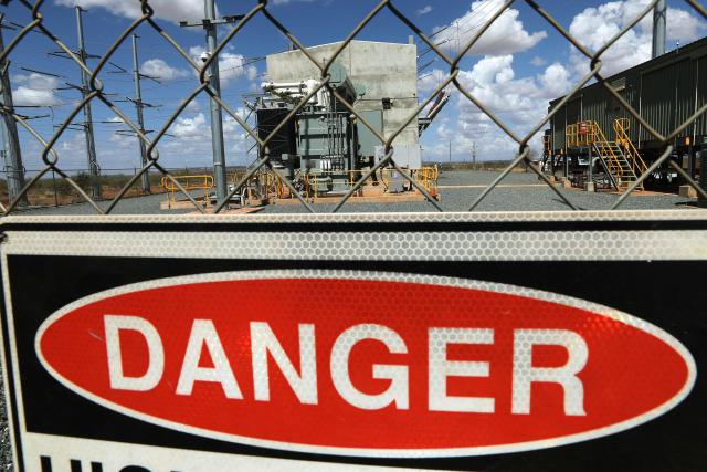 Fortescue’s first large-scale Battery Energy Storage System (BESS) is seen at North Star Junction in Pilbara, Western Australia on February 12, 2026. This installation is the first in a planned 4-5GWh rollout of large-scale storage systems that will be required to decarbonise Fortescue’s energy supply over the coming years. (Photo by Antony DICKSON / AFP)