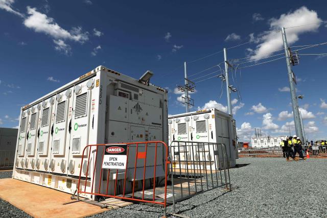 Fortescue’s first large-scale Battery Energy Storage System (BESS) is seen at North Star Junction in Pilbara, Western Australia on February 12, 2026. This installation is the first in a planned 4-5GWh rollout of large-scale storage systems that will be required to decarbonise Fortescue’s energy supply over the coming years. (Photo by Antony DICKSON / AFP)