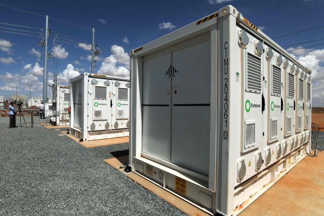 Fortescue’s first large-scale Battery Energy Storage System (BESS) is seen at North Star Junction in Pilbara, Western Australia on February 12, 2026. This installation is the first in a planned 4-5GWh rollout of large-scale storage systems that will be required to decarbonise Fortescue’s energy supply over the coming years. (Photo by Antony DICKSON / AFP)