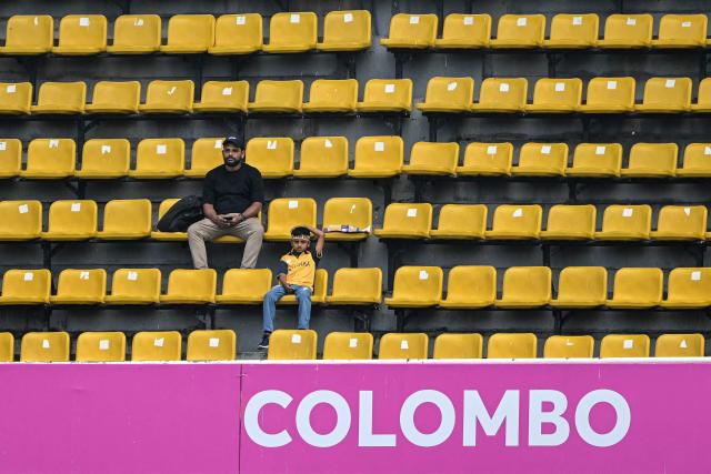Spectators wait for the start of the 2026 ICC Men's T20 Cricket World Cup group stage match between Australia and Zimbabwe at the R Premadasa Stadium in Colombo on February 13, 2026. (Photo by Ishara S. KODIKARA / AFP)