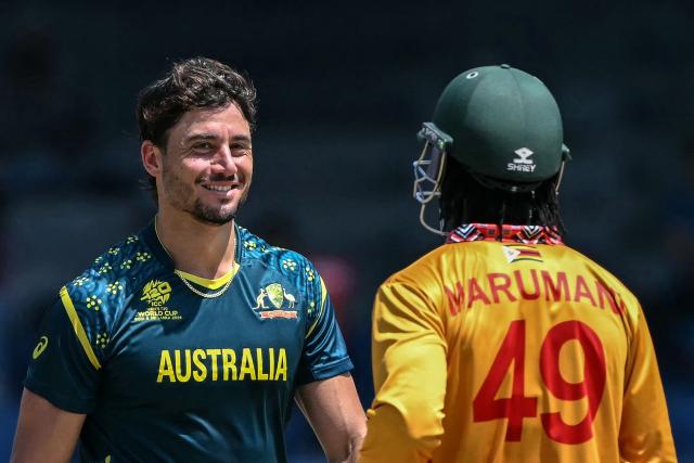 Australia's Marcus Stoinis (L) reacts after taking the wicket of Zimbabwe's Tadiwanashe Marumani (R) during the 2026 ICC Men's T20 Cricket World Cup group stage match between Australia and Zimbabwe at the R Premadasa Stadium in Colombo on February 13, 2026. (Photo by Ishara S. KODIKARA / AFP)