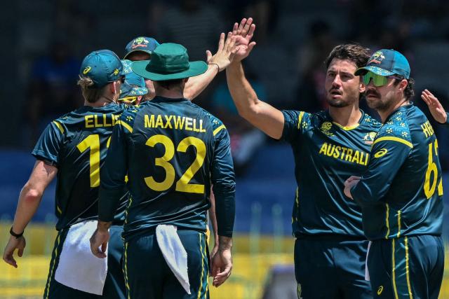 Australia's Marcus Stoinis (2R) celebrates with teammates after taking the wicket of Zimbabwe's Tadiwanashe Marumani during the 2026 ICC Men's T20 Cricket World Cup group stage match between Australia and Zimbabwe at the R Premadasa Stadium in Colombo on February 13, 2026. (Photo by Ishara S. KODIKARA / AFP)