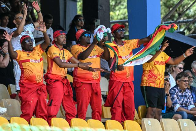 Zimbabwe's fans cheer while watching the 2026 ICC Men's T20 Cricket World Cup group stage match between Australia and Zimbabwe at the R Premadasa Stadium in Colombo on February 13, 2026. (Photo by Ishara S. KODIKARA / AFP)