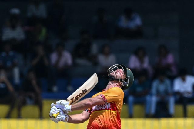 Zimbabwe's Ryan Burl watches the ball after playing a shot during the 2026 ICC Men's T20 Cricket World Cup group stage match between Australia and Zimbabwe at the R Premadasa Stadium in Colombo on February 13, 2026. (Photo by Ishara S. KODIKARA / AFP)
