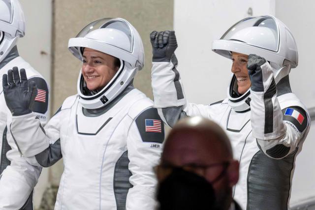NASA astronauts Jessica Meir (L) and ESA (European Space Agency) astronaut Sophie Adenot (R) walk out as they prepare to travel to the SpaceX Falcon 9 rocket with the company's Dragon spacecraft at Space Launch Complex 40 for the Crew-12 mission at Cape Canaveral Space Force Station in Florida, on February 13, 2026. (Photo by Jim WATSON / AFP)