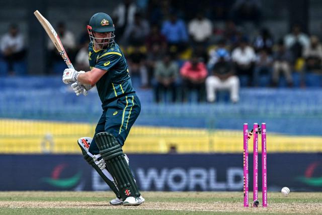 Australia's Travis Head is clean bowled by Zimbabwe's Brad Evans during the 2026 ICC Men's T20 Cricket World Cup group stage match between Australia and Zimbabwe at the R Premadasa Stadium in Colombo on February 13, 2026. (Photo by Ishara S. KODIKARA / AFP)