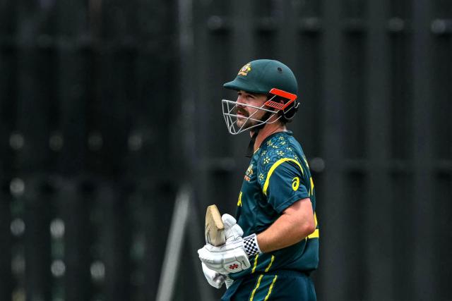Australia's Travis Head walks back to the pavilion after his dismissal during the 2026 ICC Men's T20 Cricket World Cup group stage match between Australia and Zimbabwe at the R Premadasa Stadium in Colombo on February 13, 2026. (Photo by Ishara S. KODIKARA / AFP)