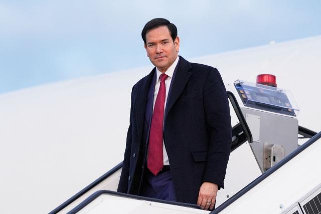 US Secretary of State Marco Rubio disembarks from his plane, on February 12, 2026, at Munich airport, before attending the Munich Security Conference. (Photo by Alex Brandon / POOL / AFP)