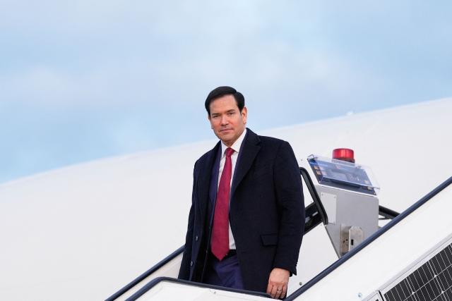 US Secretary of State Marco Rubio disembarks from his plane, on February 12, 2026, at Munich airport, before attending the Munich Security Conference. (Photo by Alex Brandon / POOL / AFP)