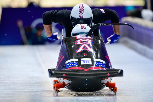 USA's Frankie Del Duca pilots in the bobsleigh men's 2-man training Heat 3 at Cortina Sliding Centre during the Milano Cortina 2026 Winter Olympic Games in Cortina d'Ampezzo on February 13, 2026. (Photo by Stefano RELLANDINI / AFP)
