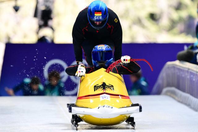Germany's Francesco Friedrich pilots in the bobsleigh men's 2-man training Heat 3 at Cortina Sliding Centre during the Milano Cortina 2026 Winter Olympic Games in Cortina d'Ampezzo on February 13, 2026. (Photo by Stefano RELLANDINI / AFP)