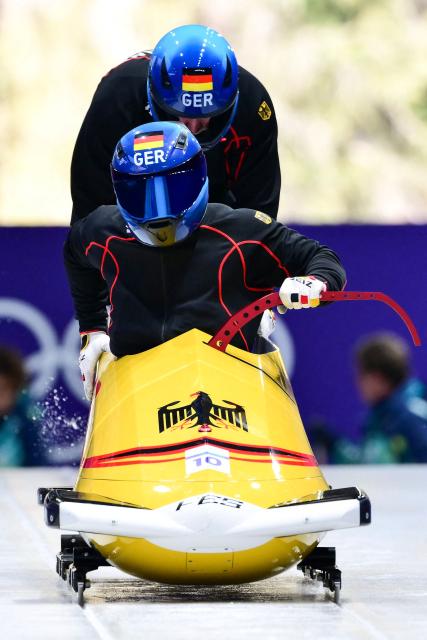 Germany's Francesco Friedrich pilots in the bobsleigh men's 2-man training Heat 3 at Cortina Sliding Centre during the Milano Cortina 2026 Winter Olympic Games in Cortina d'Ampezzo on February 13, 2026. (Photo by Stefano RELLANDINI / AFP)