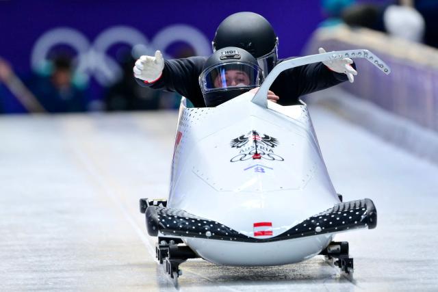Austria's Jakob Mandlbauer pilots in the bobsleigh men's 2-man training Heat 3 at Cortina Sliding Centre during the Milano Cortina 2026 Winter Olympic Games in Cortina d'Ampezzo on February 13, 2026. (Photo by Stefano RELLANDINI / AFP)