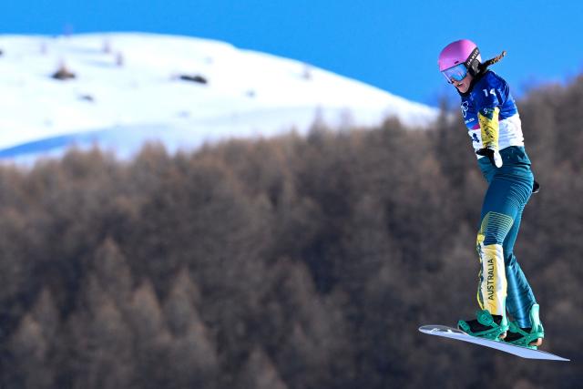 Australia's Josie Baff competes in the snowboard women's cross seeding run 1 during the Milano Cortina 2026 Winter Olympic Games at Livigno Snow Park, in Livigno (Valtellina), on February 13, 2026. (Photo by Kirill KUDRYAVTSEV / AFP)