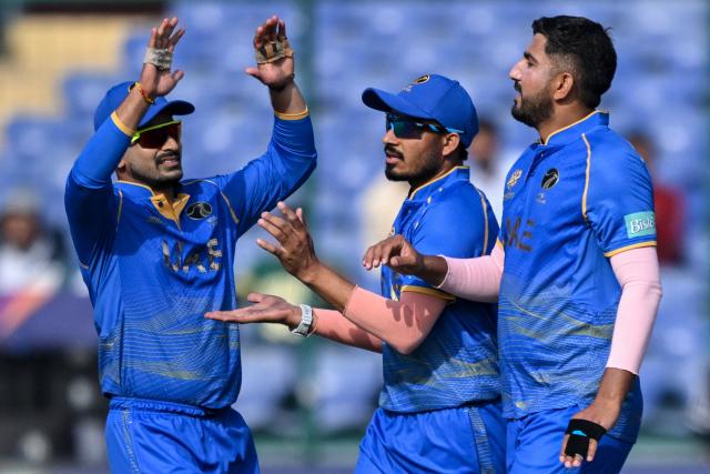 UAE's Junaid Siddique (R) celebrates with teammates after taking the wicket of Canada's Yuvraj Samra during the 2026 ICC Men's T20 Cricket World Cup group stage match between Canada and United Arab Emirates at the Arun Jaitley Stadium in New Delhi on February 13, 2026. (Photo by Arun SANKAR / AFP)