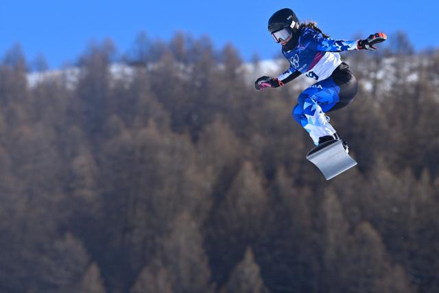 Estonia's Mai Brit Teder competes in the snowboard women's cross seeding run 1 during the Milano Cortina 2026 Winter Olympic Games at Livigno Snow Park, in Livigno (Valtellina), on February 13, 2026. (Photo by Kirill KUDRYAVTSEV / AFP)