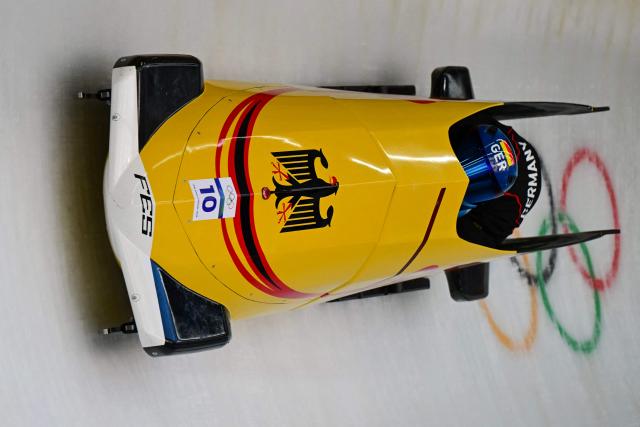 Germany's Francesco Friedrich pilots in the bobsleigh men's 2-man training Heat 4 at Cortina Sliding Centre during the Milano Cortina 2026 Winter Olympic Games in Cortina d'Ampezzo on February 13, 2026. (Photo by Stefano RELLANDINI / AFP)