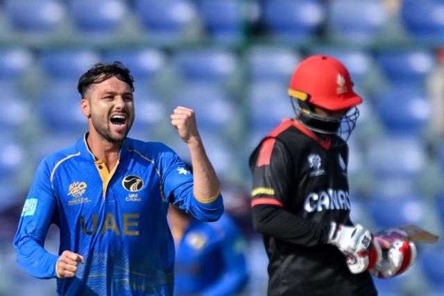 UAE's Muhammad Jawadullah (L) celebrates after taking the wicket of Canada's Nicholas Kirton during the 2026 ICC Men's T20 Cricket World Cup group stage match between Canada and United Arab Emirates at the Arun Jaitley Stadium in New Delhi on February 13, 2026. (Photo by Arun SANKAR / AFP)