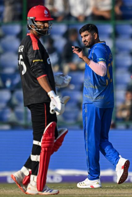 UAE's Junaid Siddique (R) celebrates after taking the wicket of Canada's Shreyas Movva during the 2026 ICC Men's T20 Cricket World Cup group stage match between Canada and United Arab Emirates at the Arun Jaitley Stadium in New Delhi on February 13, 2026. (Photo by Arun SANKAR / AFP)