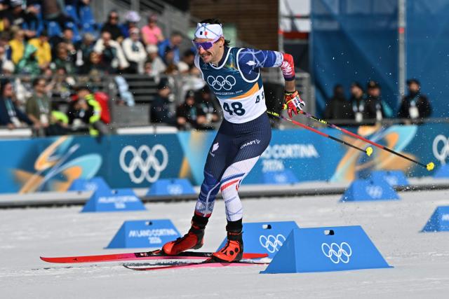 France's Hugo Lapalus competes during the men's 10km cross-country interval start free event of the Milano Cortina 2026 Winter Olympic Games at Tesero Cross-Country Skiing Stadium in Lago di Tesero (Val di Fiemme) on February 13, 2026. (Photo by Javier SORIANO / AFP)