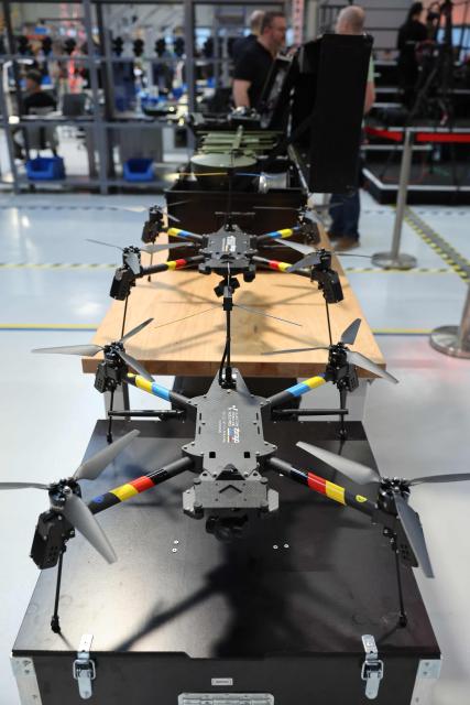 Drones are decorated in the colors of Ukraine and Germany, pictured during a visit of the Ukrainian President and the German Defence Minister at the production facility of drone producing company Quantum Frontline Industries (QFI) in Gilching near Munich, southern Germany, on the sidelines of the 62nd Munich Security Conference (MSC) on February 13, 2026. Heads of state and government as well as foreign and defence ministers from all over the world are expected to attend the security policy talks from February 13 to 15, 2026. (Photo by Alexandra BEIER / AFP)