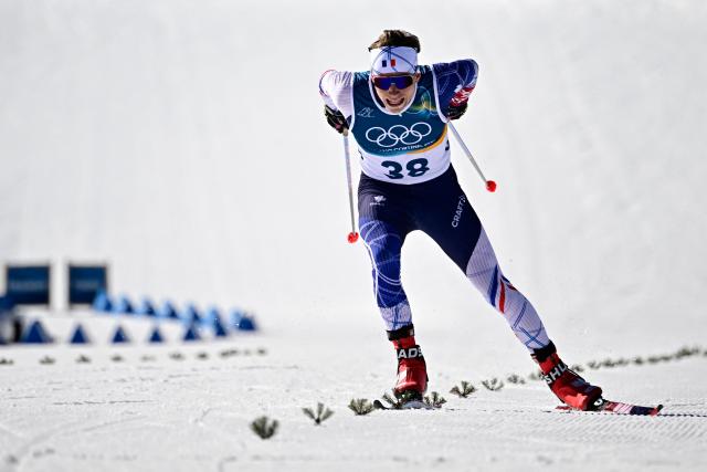 France's Victor Lovera sprints to the finish line during the men's 10km cross-country interval start free event of the Milano Cortina 2026 Winter Olympic Games at Tesero Cross-Country Skiing Stadium in Lago di Tesero (Val di Fiemme) on February 13, 2026. (Photo by Tobias SCHWARZ / AFP)