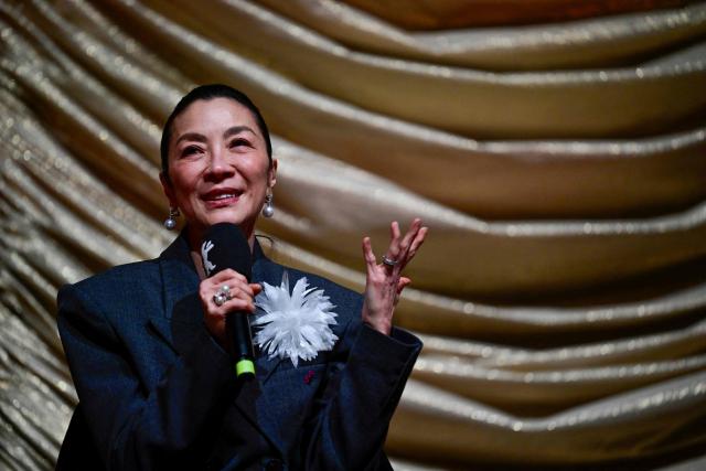 Malaysian actress Michelle Yeoh adresses the audience prior to the premiere of the film 'Everything Everywhere All At Once' by US director Sean Baker at the Zoo Palast cinema during the Berlinale, Europe's first major film festival of the year, in Berlin on February 13, 2026. (Photo by John MACDOUGALL / AFP)