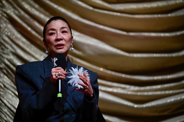 Malaysian actress Michelle Yeoh thanks the audience prior to the premiere of the film 'Everything Everywhere All At Once' by US director Sean Baker at the Zoo Palast cinema during the Berlinale, Europe's first major film festival of the year, in Berlin on February 13, 2026. (Photo by John MACDOUGALL / AFP)