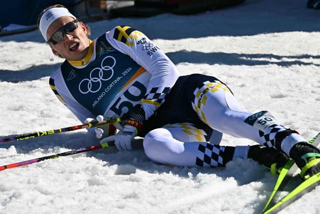 Sweden's Gustaf Berglund reacts after crossing the finish line during the men's 10km cross-country interval start free event of the Milano Cortina 2026 Winter Olympic Games at Tesero Cross-Country Skiing Stadium in Lago di Tesero (Val di Fiemme) on February 13, 2026. (Photo by Javier SORIANO / AFP)