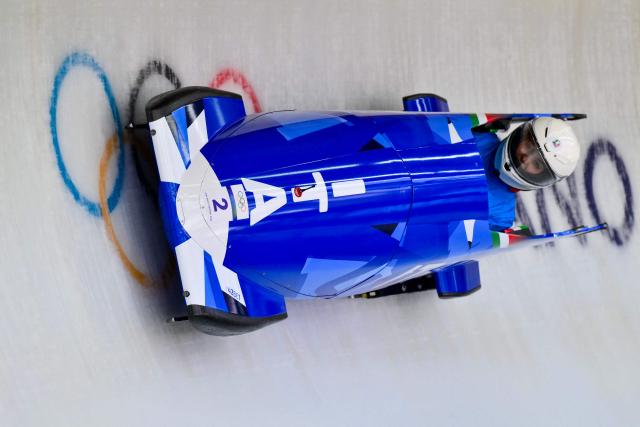 Italy's Giada Andreutti pilots in the bobsleigh women's monobob training Heat 3 at Cortina Sliding Centre during the Milano Cortina 2026 Winter Olympic Games in Cortina d'Ampezzo on February 13, 2026. (Photo by Stefano RELLANDINI / AFP)