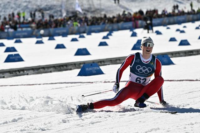 Norway's Einar Hedegart reacts after crossing the finish line during the men's 10km cross-country interval start free event of the Milano Cortina 2026 Winter Olympic Games at Tesero Cross-Country Skiing Stadium in Lago di Tesero (Val di Fiemme) on February 13, 2026. (Photo by Javier SORIANO / AFP)